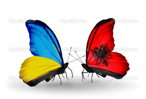 Two butterflies with flags on wings as symbol of relations Ukraine and Albania